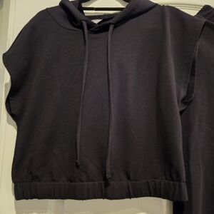 Sleeveless Black Hoodie Top - Casual Women' s pant outfit. Pants have flare legs